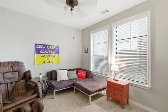 a living room with furniture and a window