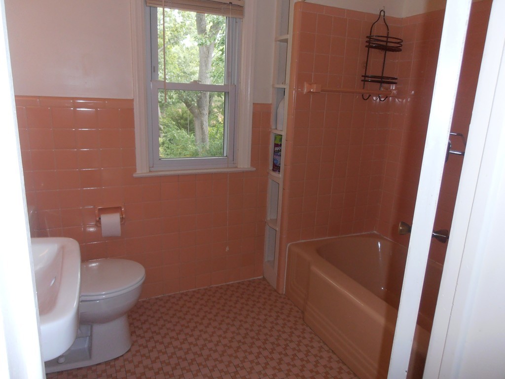 168 Emerson Street Springfield, MA 01118 - Photo 11 of 14 a bathroom with a toilet and a bath tub