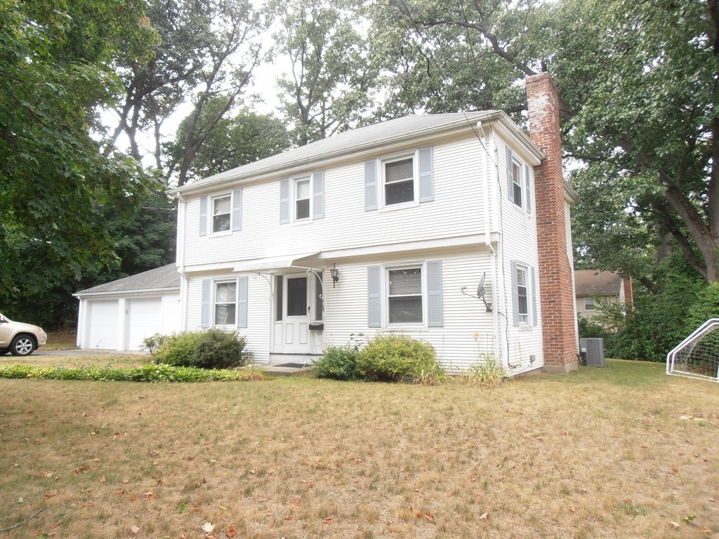 168 Emerson Street Springfield, MA 01118 - Photo 14 of 14 a view of a white house with a yard and large tree