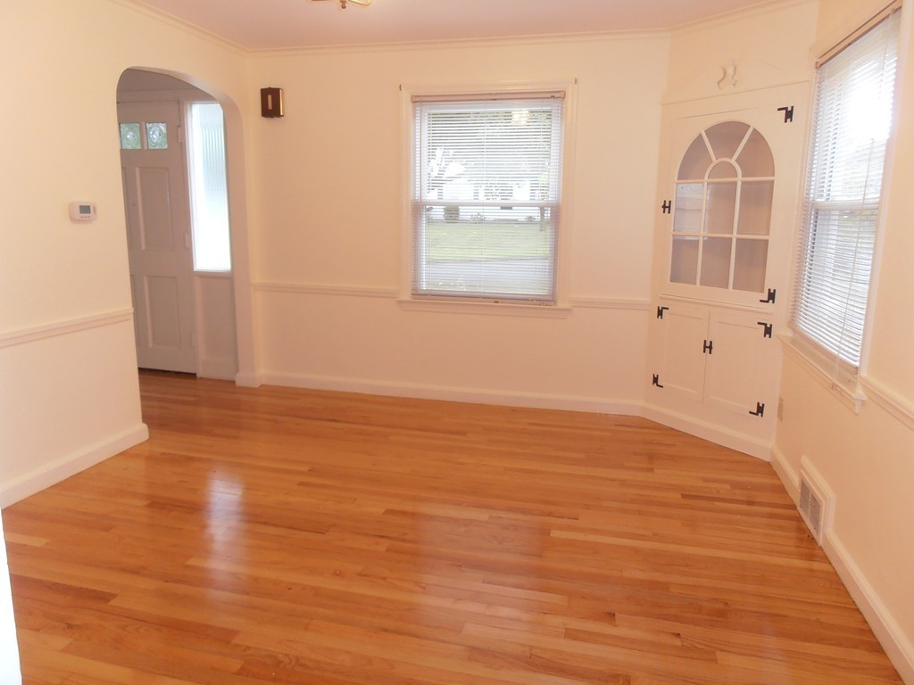 168 Emerson Street Springfield, MA 01118 - Photo 2 of 14 a view of an empty room with wooden floor and a window