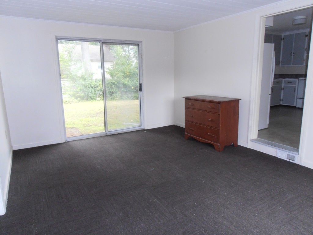 168 Emerson Street Springfield, MA 01118 - Photo 5 of 14 a view of an empty room with a window