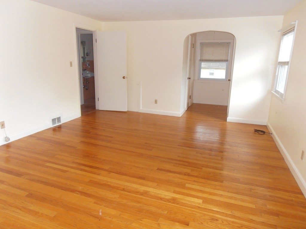 168 Emerson Street Springfield, MA 01118 - Photo 6 of 14 a view of empty room with wooden floor