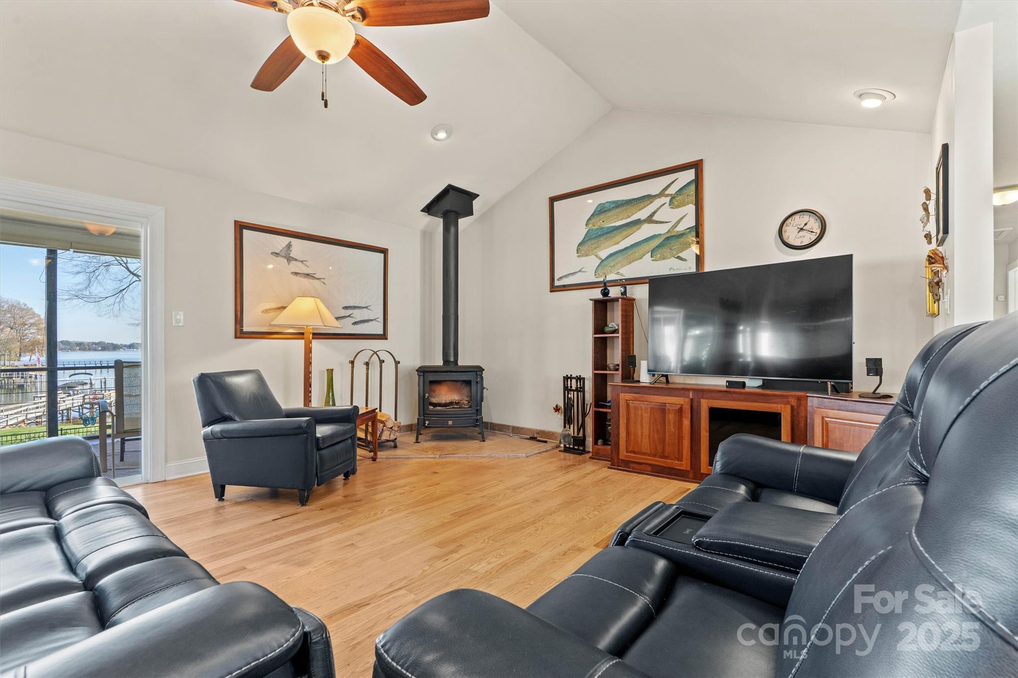 2488 Primm Road Denver, NC 28037 - Photo 11 of 48 a living room with furniture and a flat screen tv