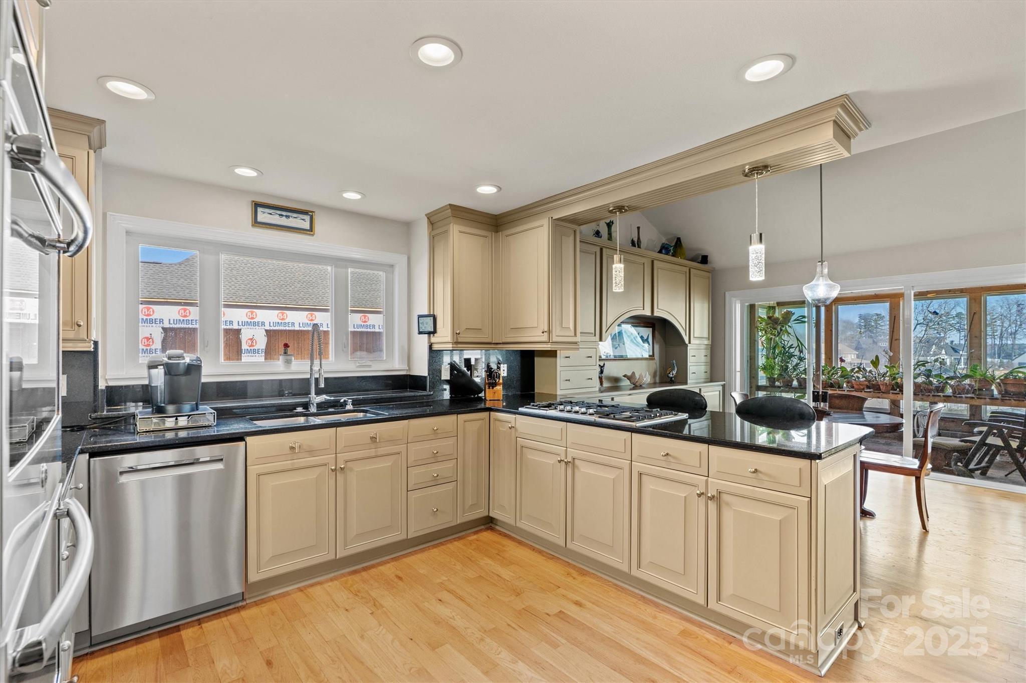 2488 Primm Road Denver, NC 28037 - Photo 14 of 48 a kitchen with granite countertop a sink and cabinets