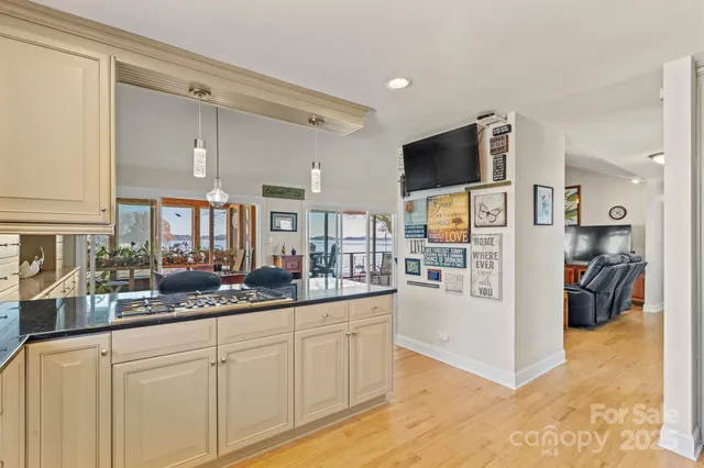 a kitchen with stainless steel appliances granite countertop a sink and cabinets