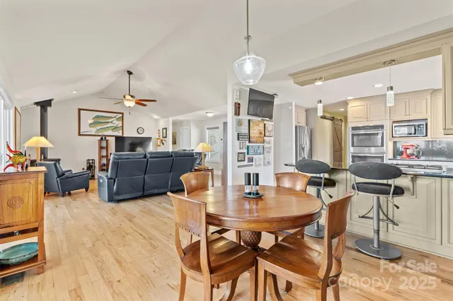 a dining room with furniture and window