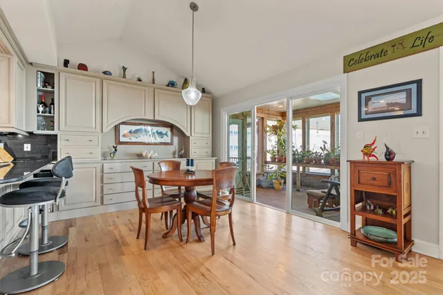 a bedroom with bed and painting on the wall
