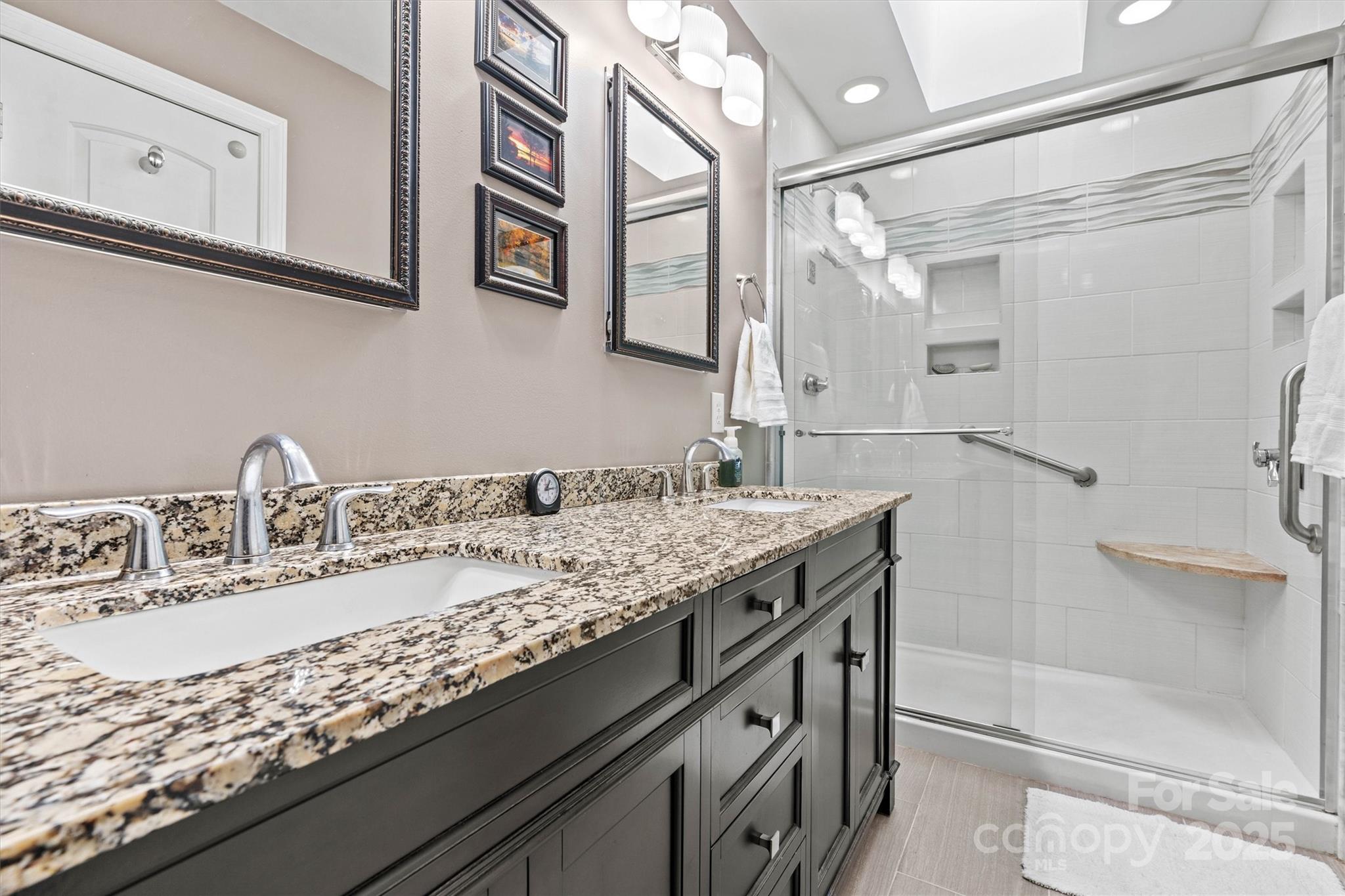 2488 Primm Road Denver, NC 28037 - Photo 23 of 48 a bathroom with a granite countertop sink a toilet a shower and a mirror