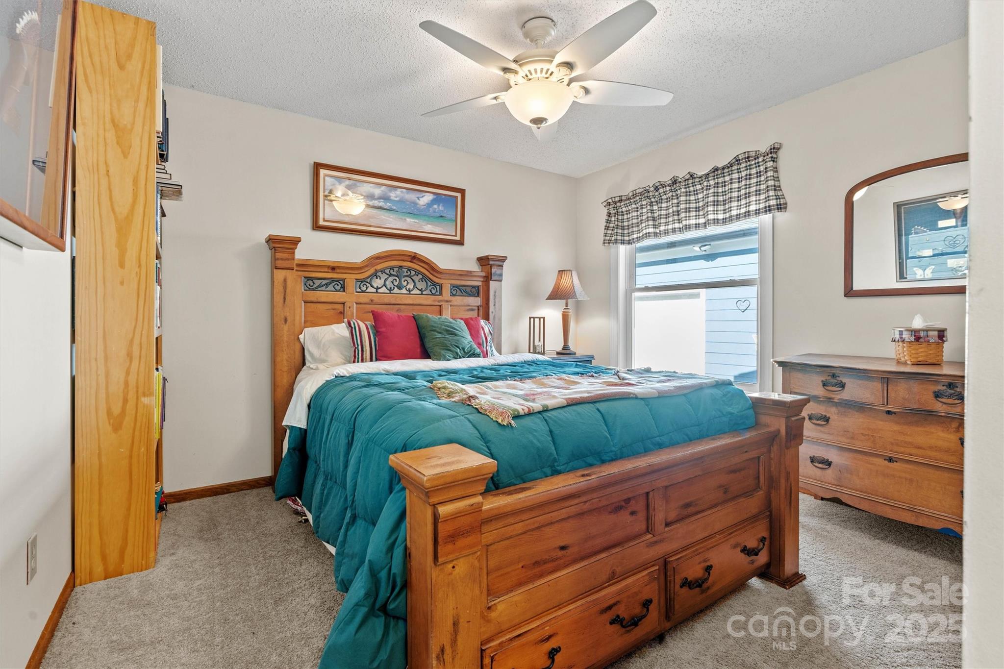 2488 Primm Road Denver, NC 28037 - Photo 25 of 48 a bedroom with a bed and a chandelier