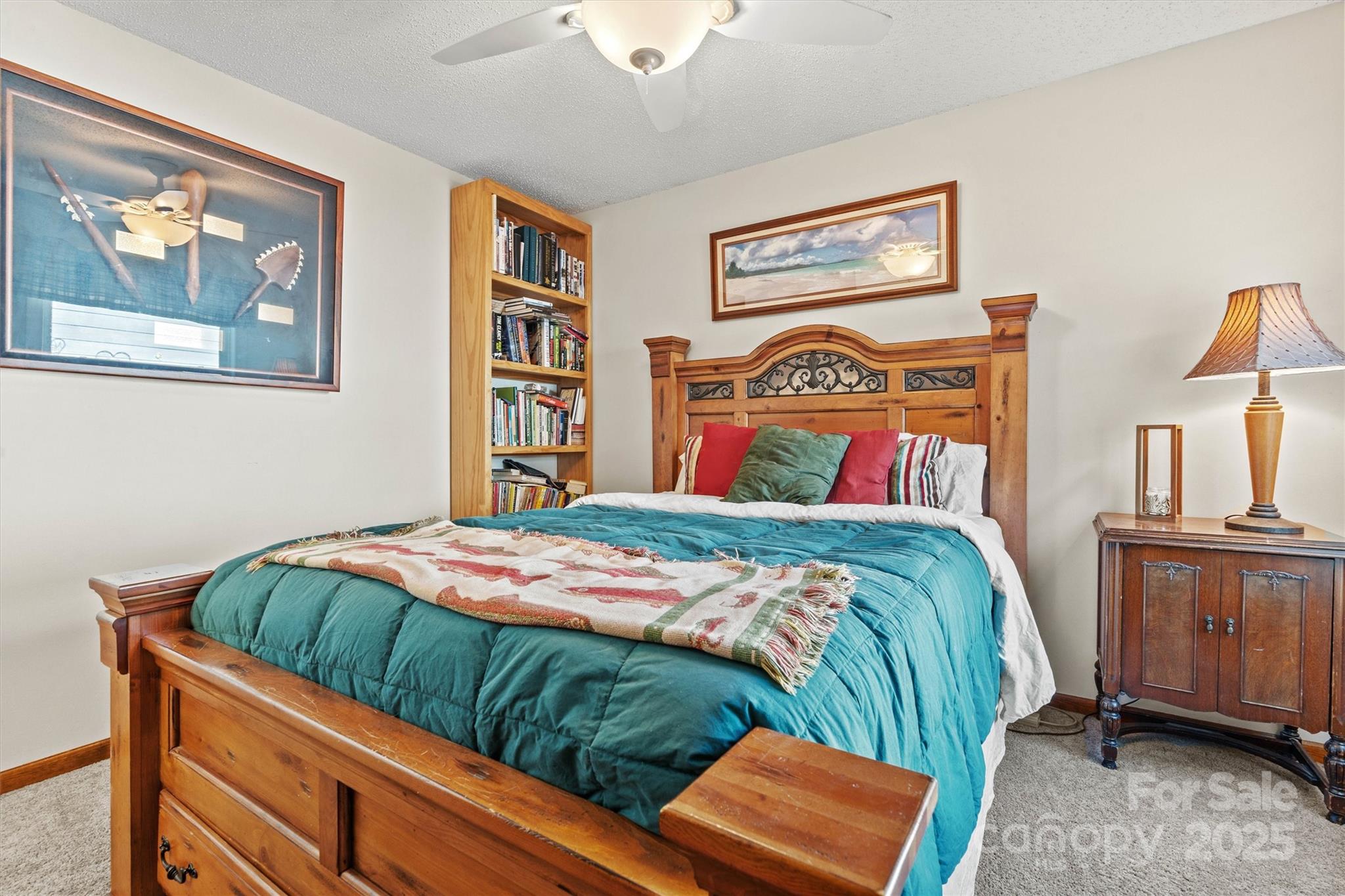 2488 Primm Road Denver, NC 28037 - Photo 26 of 48 a bedroom with bed and painting on the wall