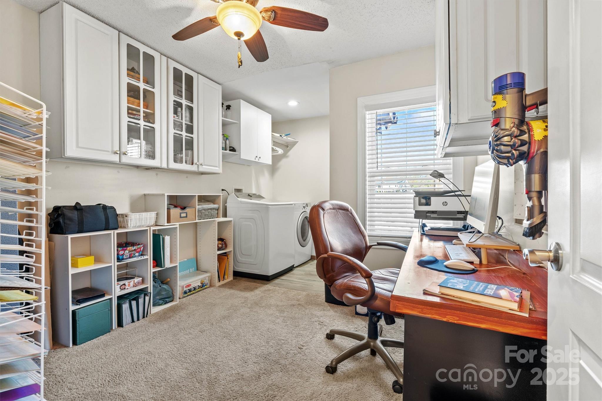 2488 Primm Road Denver, NC 28037 - Photo 30 of 48 a view of a workspace with furniture and a window
