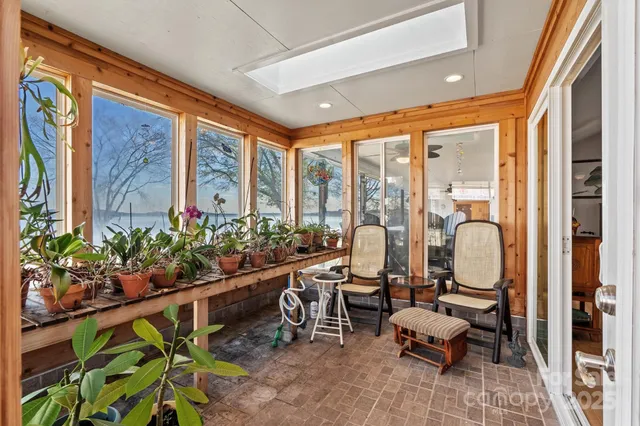 a view of balcony with wooden floor and outdoor seating