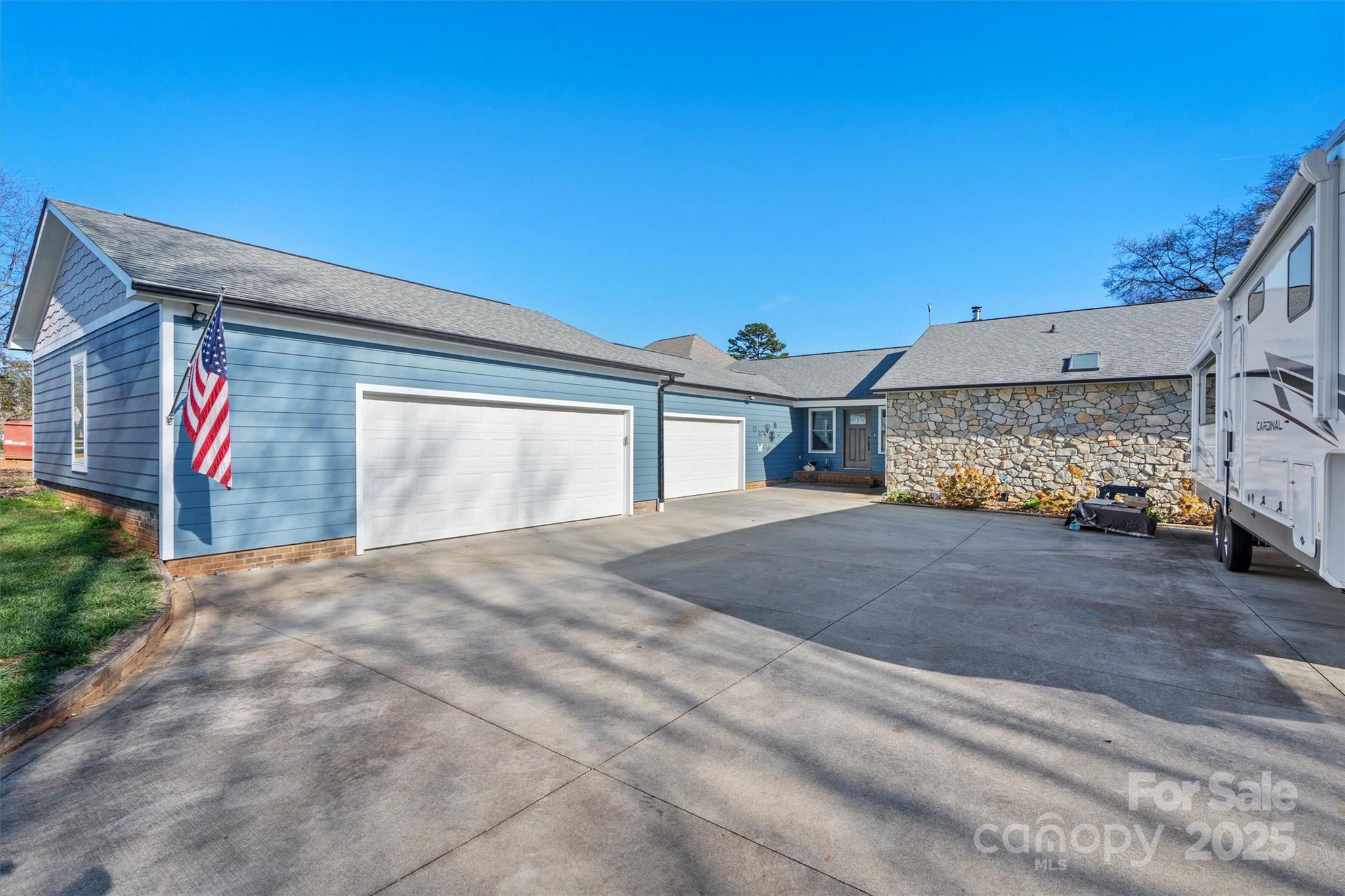 2488 Primm Road Denver, NC 28037 - Photo 6 of 48 a front view of a house with a yard and garage