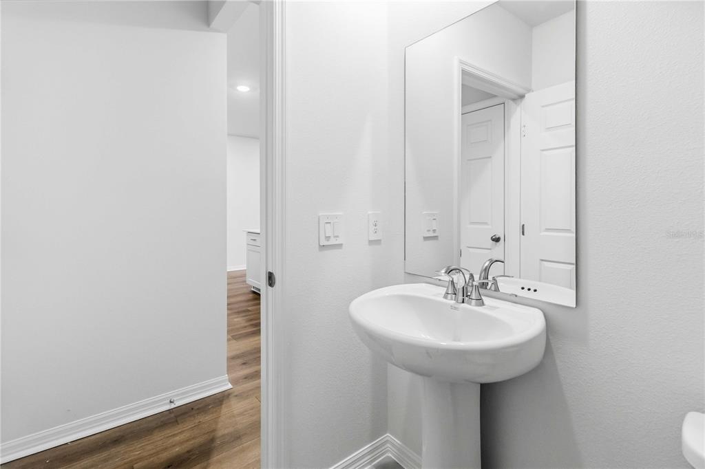 4571 Range Land Way St. Cloud, FL 34772 - Photo 13 of 43 a bathroom with a sink and a mirror