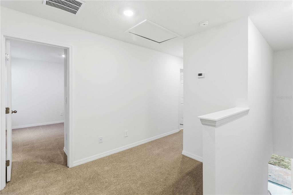 4571 Range Land Way St. Cloud, FL 34772 - Photo 15 of 43 an empty room with windows