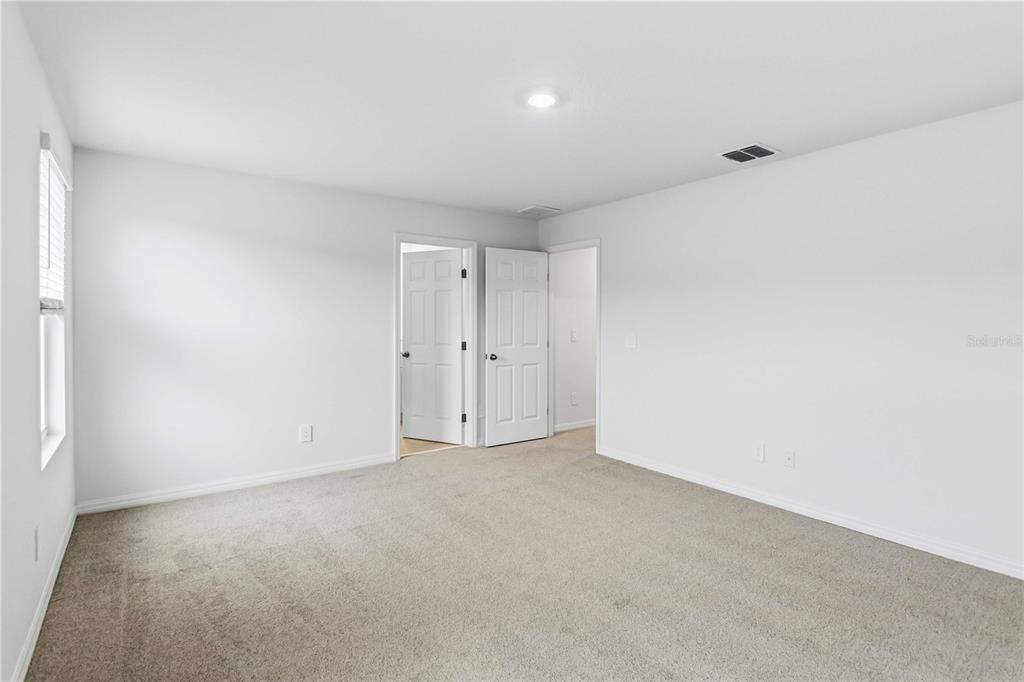 4571 Range Land Way St. Cloud, FL 34772 - Photo 17 of 43 a view of an empty room