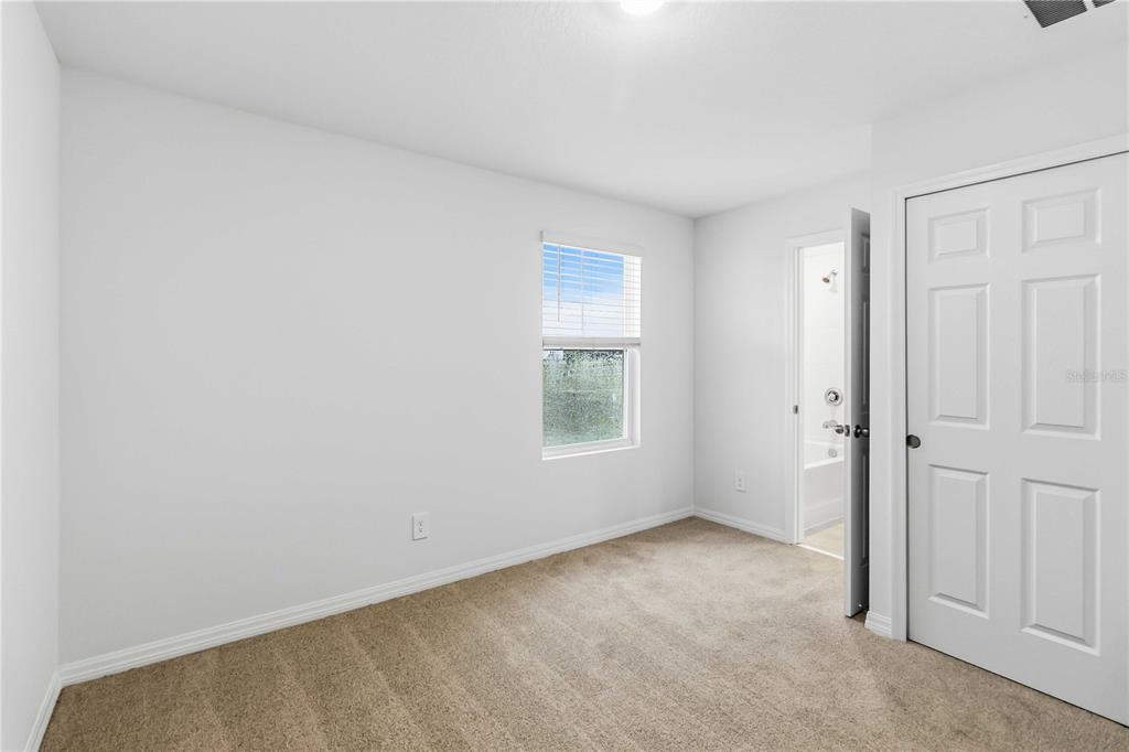 4571 Range Land Way St. Cloud, FL 34772 - Photo 24 of 43 a view of an empty room with a window