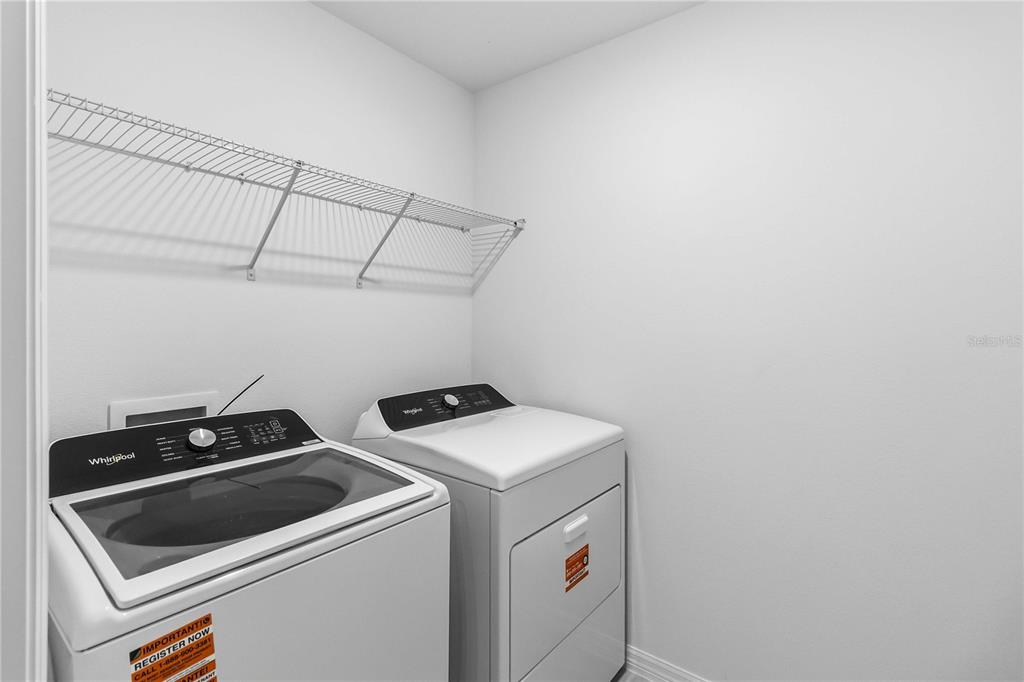 4571 Range Land Way St. Cloud, FL 34772 - Photo 29 of 43 a utility room with dryer and washer