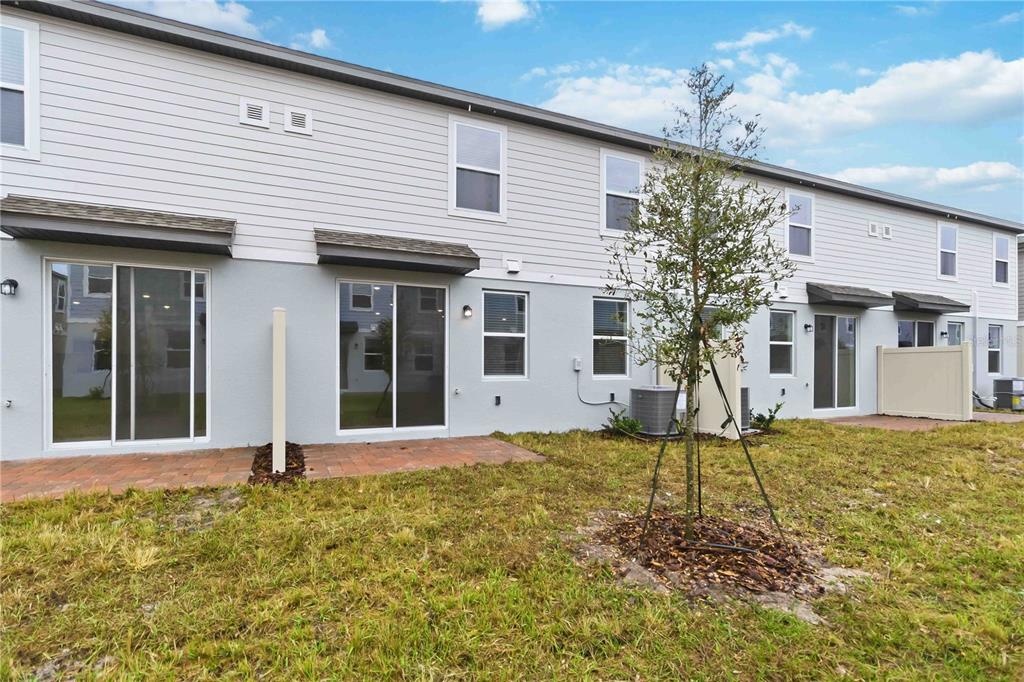 4571 Range Land Way St. Cloud, FL 34772 - Photo 30 of 43 a front view of a house with a yard