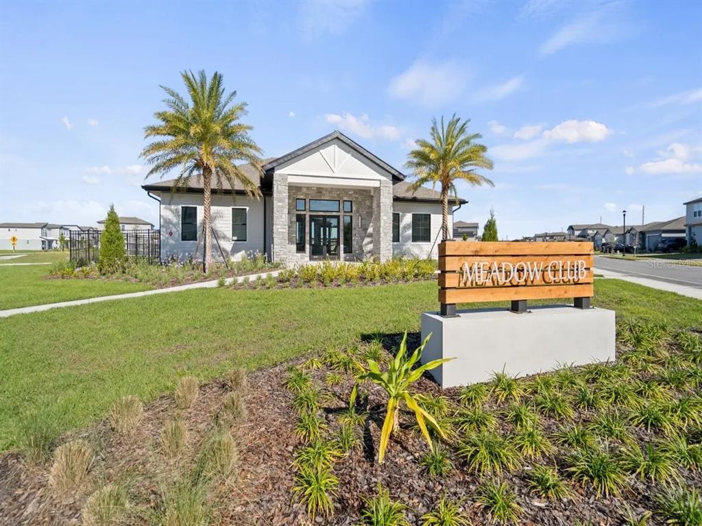 4571 Range Land Way St. Cloud, FL 34772 - Photo 36 of 43 a front view of a house with garden