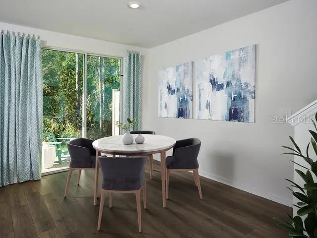 4571 Range Land Way St. Cloud, FL 34772 - Photo 4 of 43 a view of a dining room with furniture and wooden floor