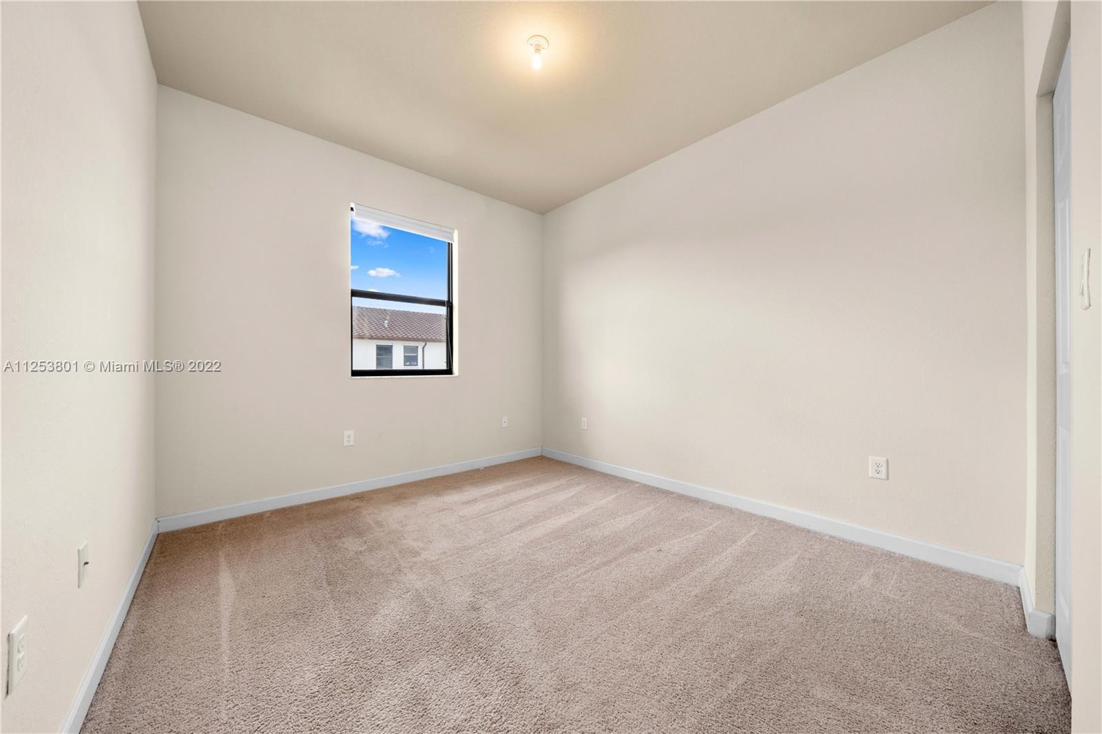3366 West 90th Terrace, Unit 3366 Hialeah, FL 33018 - Photo 19 of 26 an empty room with windows