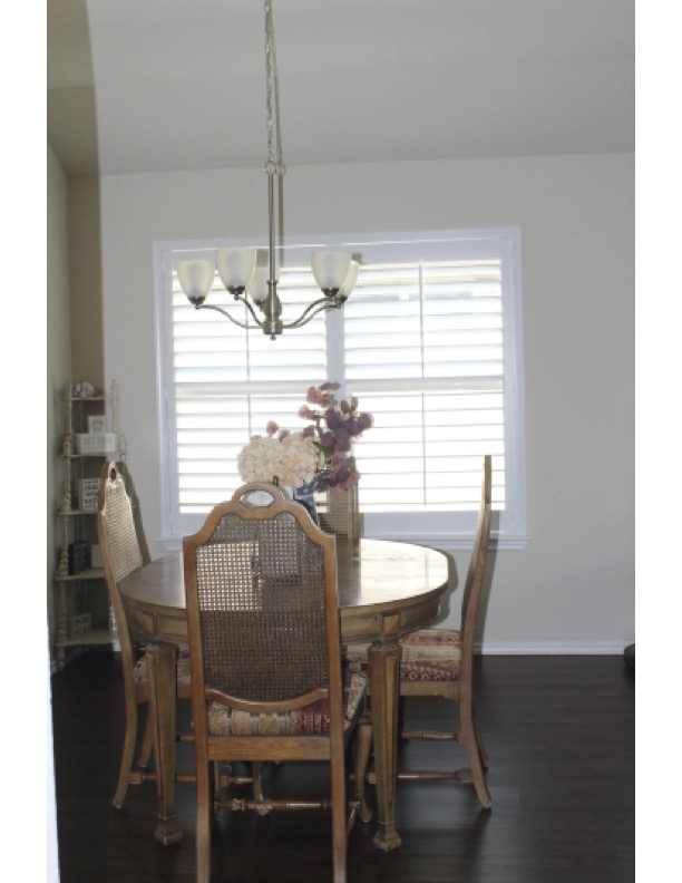 188 Beth Ann Loop Taylor, TX 76574 - Photo 4 of 12 A graceful chandelier and beautiful shutters with an open layout.