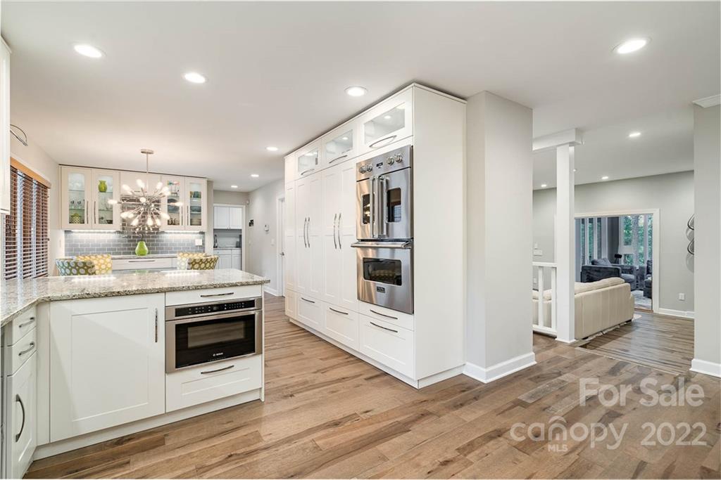 4525 Rounding Run Road Charlotte, NC 28277 - Photo 1 of 44 a kitchen with stainless steel appliances granite countertop a stove and a sink