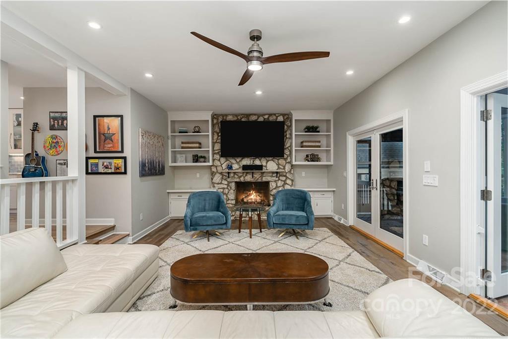 4525 Rounding Run Road Charlotte, NC 28277 - Photo 11 of 44 a living room with furniture a large window and a flat screen tv