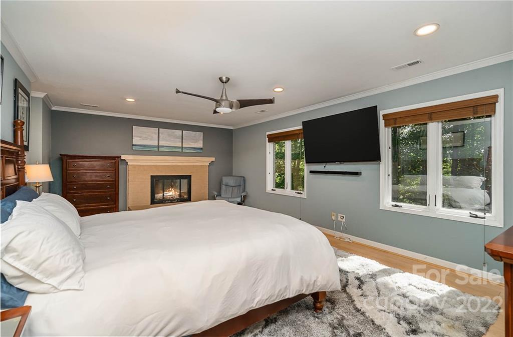 4525 Rounding Run Road Charlotte, NC 28277 - Photo 22 of 44 a bedroom with a large bed and a flat screen tv