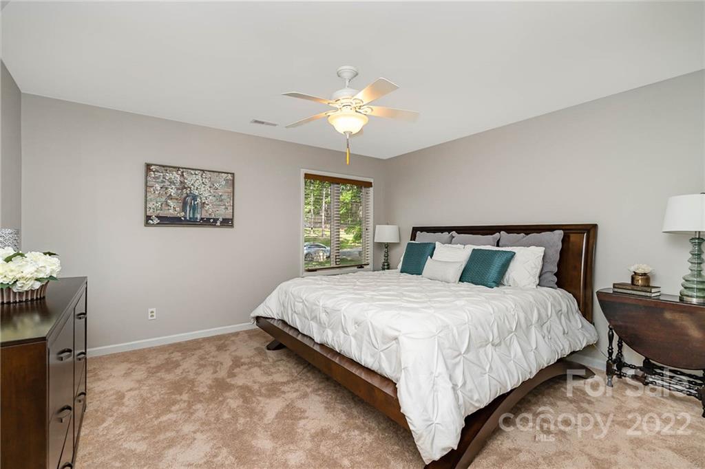 4525 Rounding Run Road Charlotte, NC 28277 - Photo 24 of 44 a bedroom with bed and window