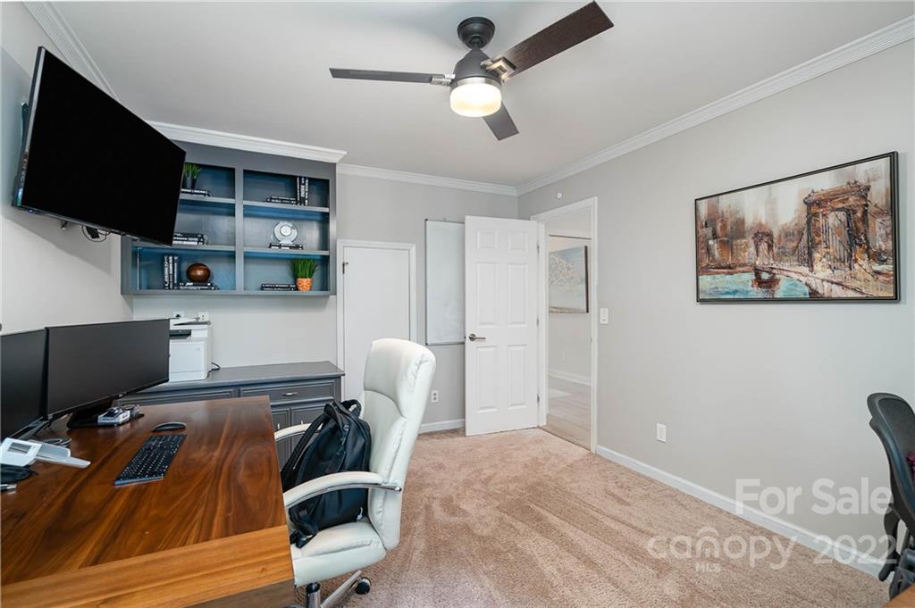 4525 Rounding Run Road Charlotte, NC 28277 - Photo 26 of 44 a view of a workspace with furniture and a flat screen tv