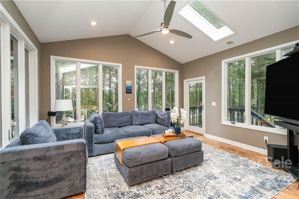 4525 Rounding Run Road Charlotte, NC 28277 - Photo 31 of 44 a living room with furniture flat screen tv and a large window