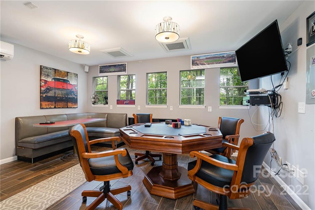 4525 Rounding Run Road Charlotte, NC 28277 - Photo 36 of 44 a view of a dining room with furniture a chandelier and wooden floor