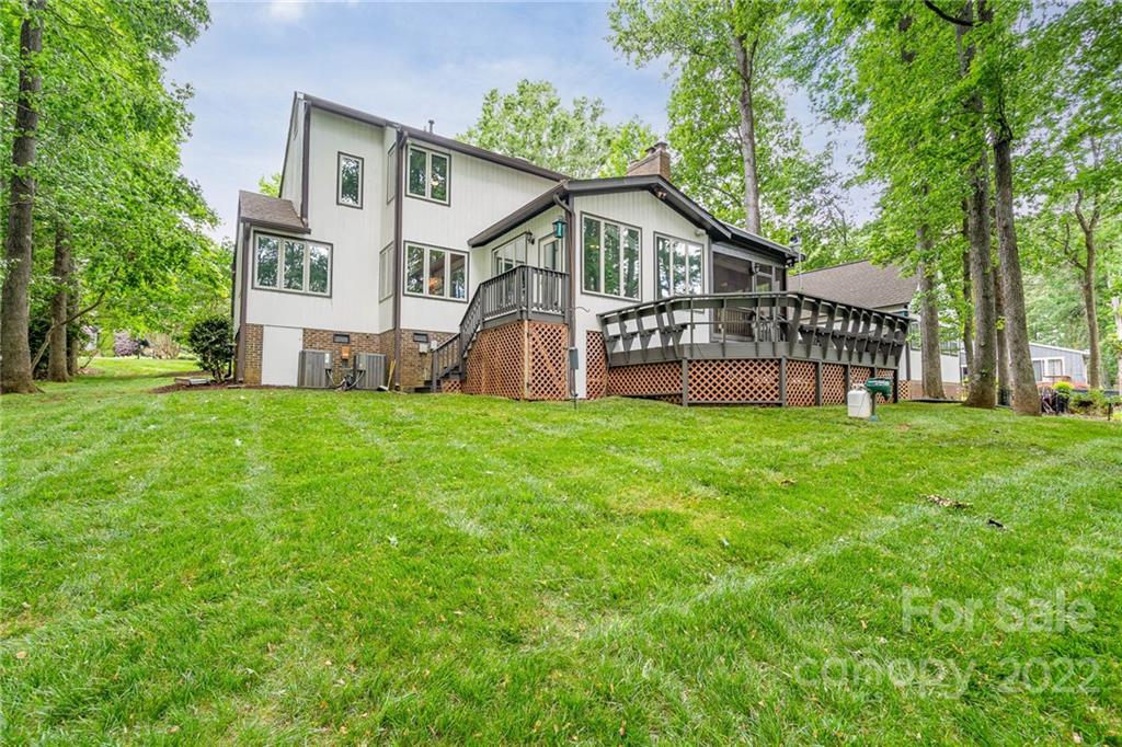 4525 Rounding Run Road Charlotte, NC 28277 - Photo 37 of 44 a view of a house with a big yard and large trees