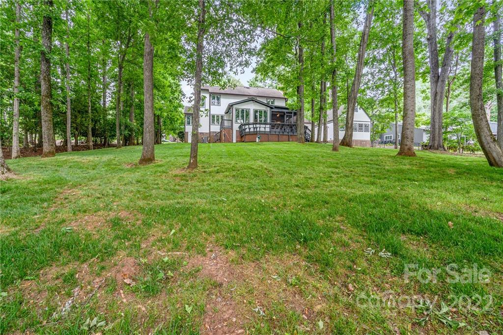4525 Rounding Run Road Charlotte, NC 28277 - Photo 41 of 44 a front view of a house with yard and green space