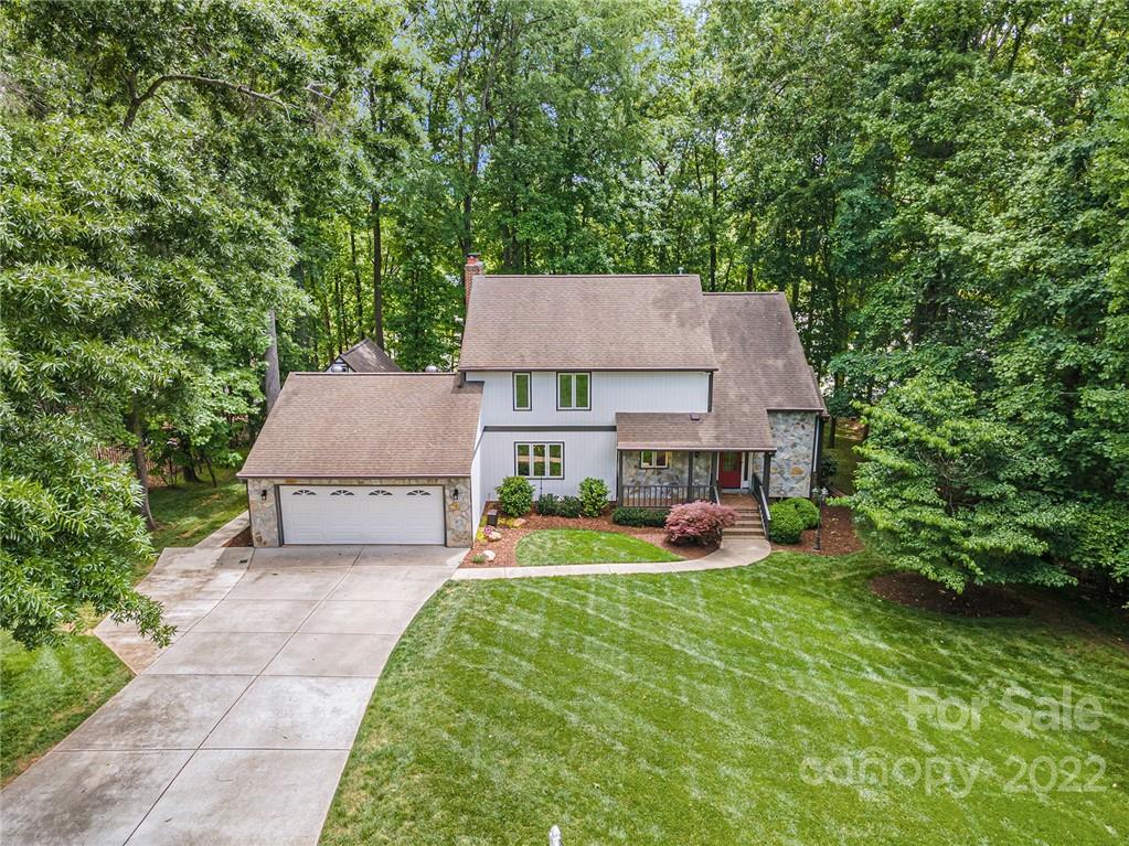 4525 Rounding Run Road Charlotte, NC 28277 - Photo 6 of 44 an aerial view of a house with swimming pool and garden