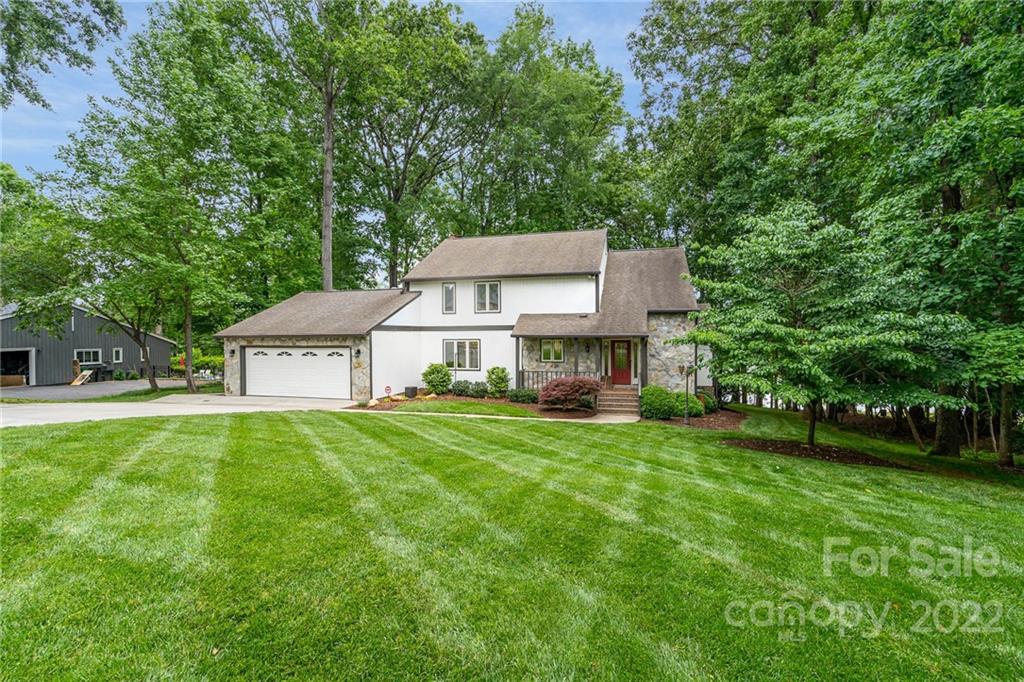 4525 Rounding Run Road Charlotte, NC 28277 - Photo 7 of 44 a view of a house with a big yard plants and large trees