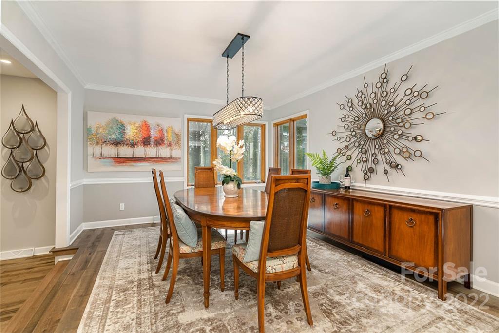 4525 Rounding Run Road Charlotte, NC 28277 - Photo 9 of 44 a view of a dining room with furniture window and wooden floor