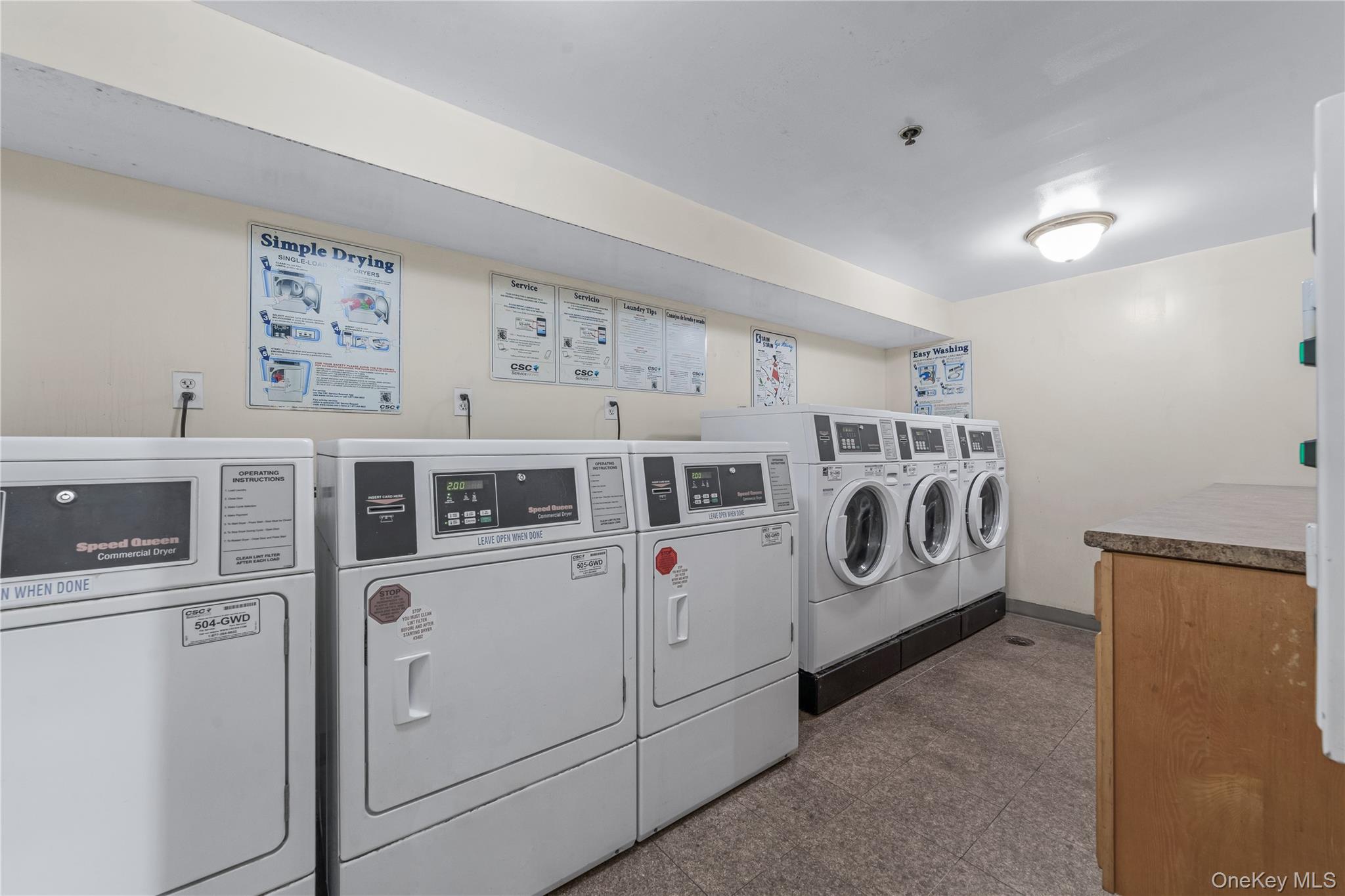 35-06 Leavitt Street, Unit 3K Queens, NY 11354 - Photo 14 of 17 Shared laundry room featuring washing machine and clothes dryer