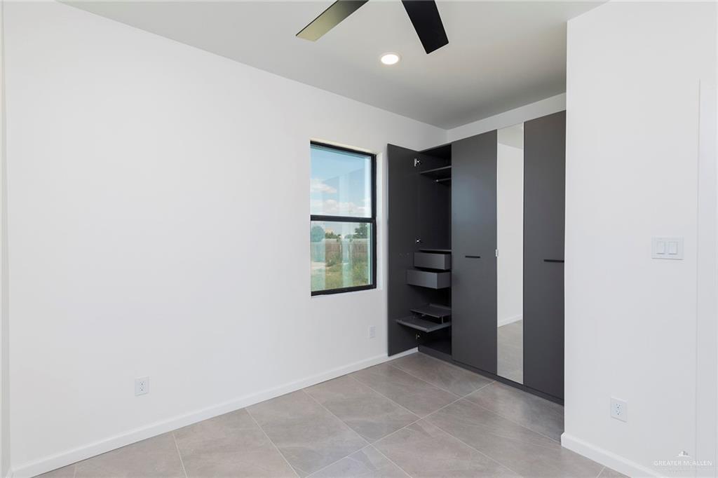 301 North 32nd Street Hidalgo, TX 78557 - Photo 11 of 22 an empty room with closet and windows