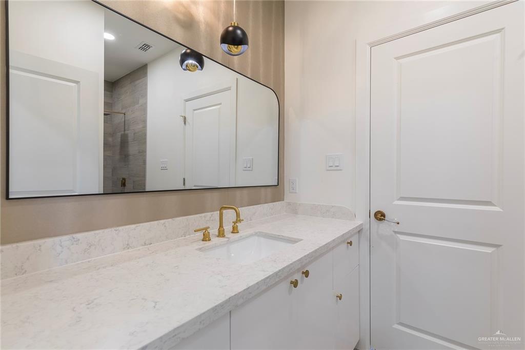 301 North 32nd Street Hidalgo, TX 78557 - Photo 15 of 22 a bathroom with a sink and a mirror