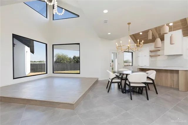 a dining room with furniture and window