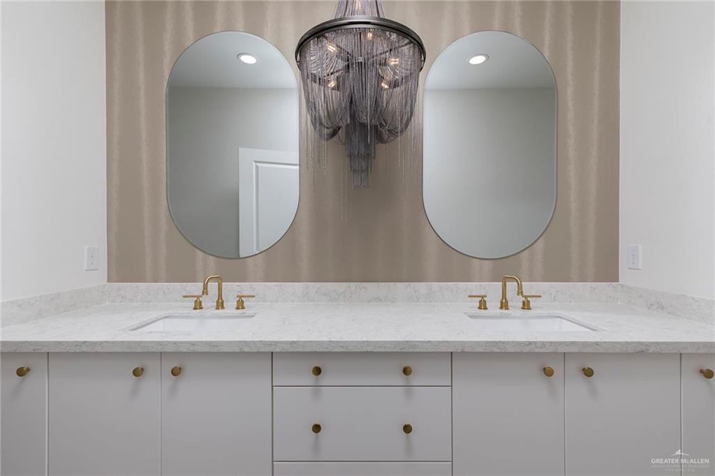 301 North 32nd Street Hidalgo, TX 78557 - Photo 7 of 22 a bathroom with a double vanity sink and a mirror