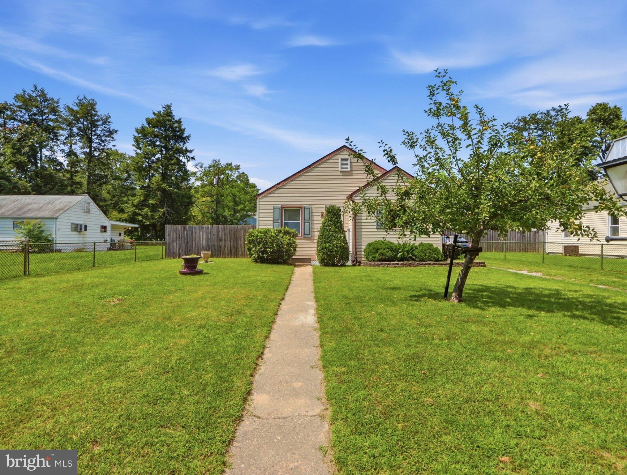 8176 Lea Road Pasadena, MD 21122 - Photo 2 of 23 Charming home with lush green yard.