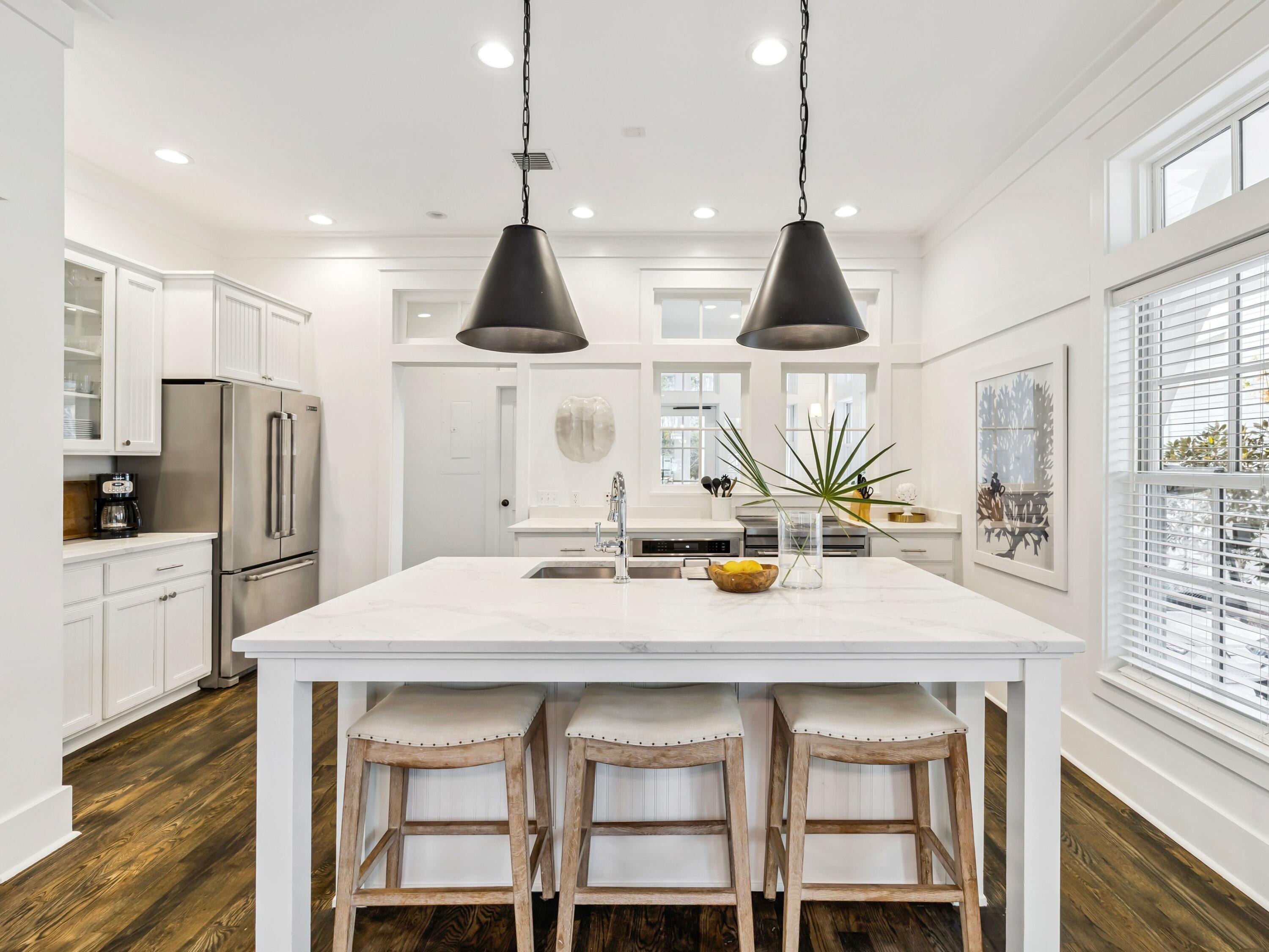 37 Winterberry Circle Santa Rosa Beach, FL 32459 - Photo 12 of 39 a kitchen with stainless steel appliances a dining table chairs and stove