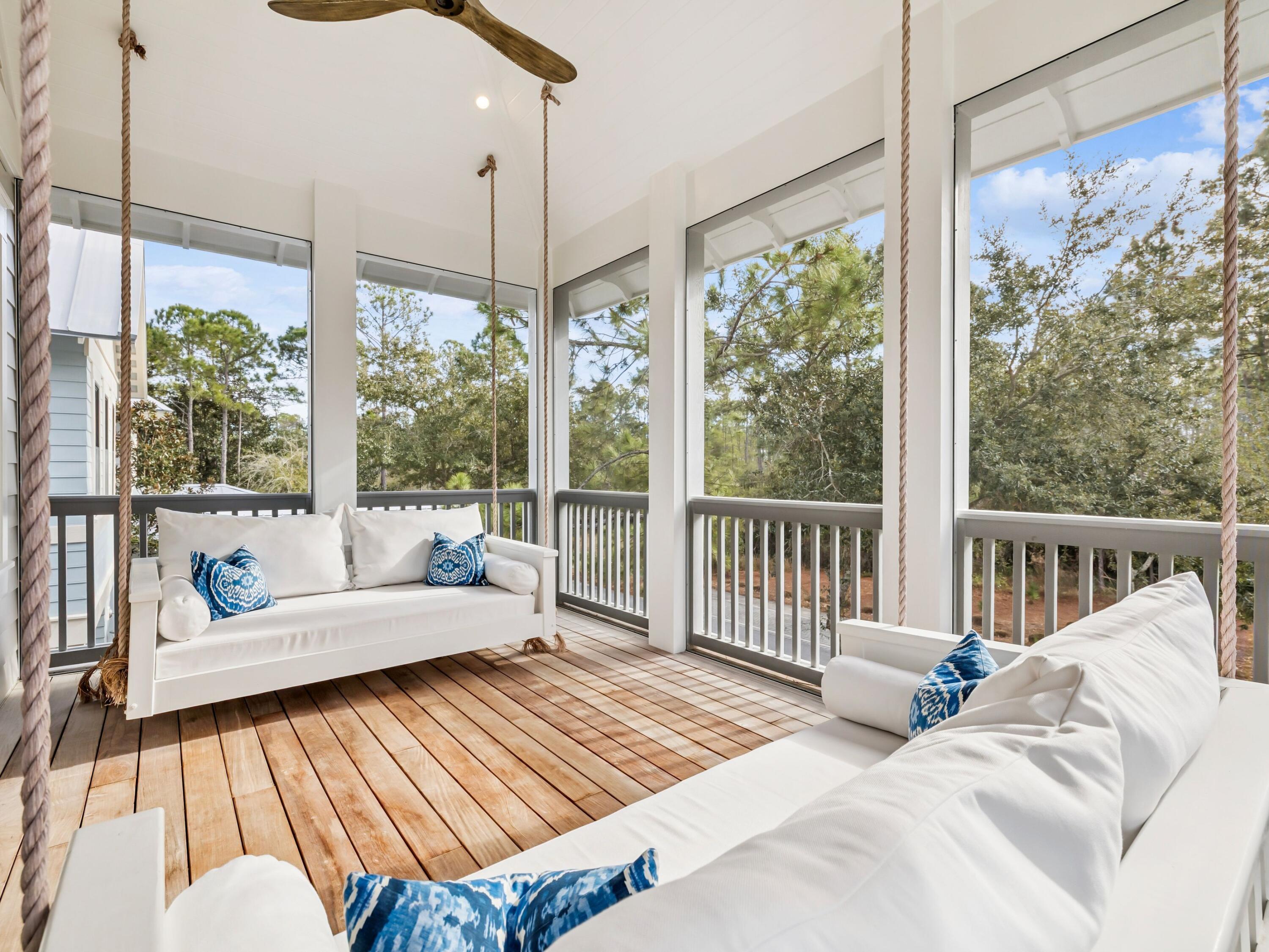 37 Winterberry Circle Santa Rosa Beach, FL 32459 - Photo 27 of 39 a living room with large windows and a table