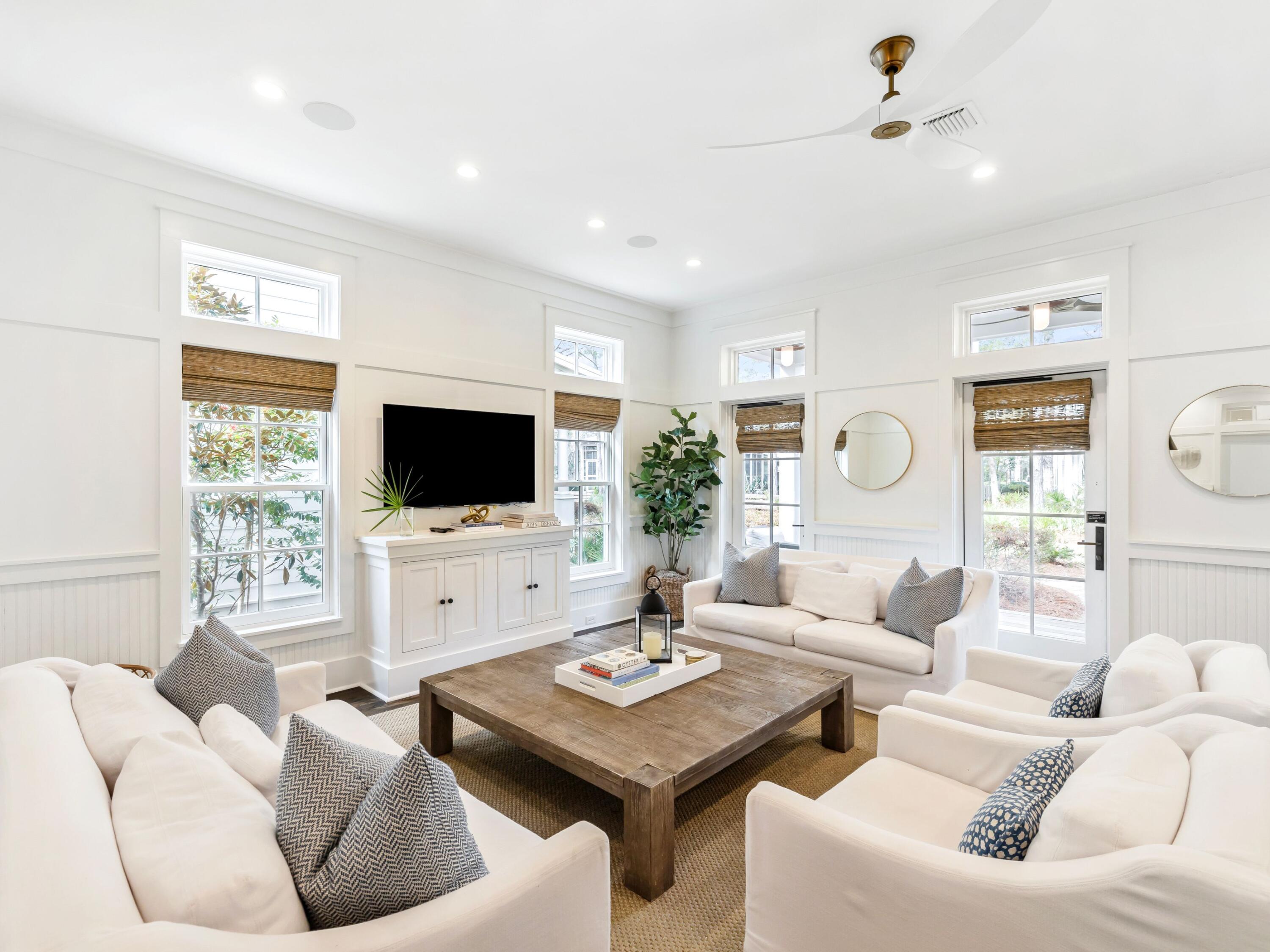 37 Winterberry Circle Santa Rosa Beach, FL 32459 - Photo 4 of 39 a living room with furniture a flat screen tv and a large window