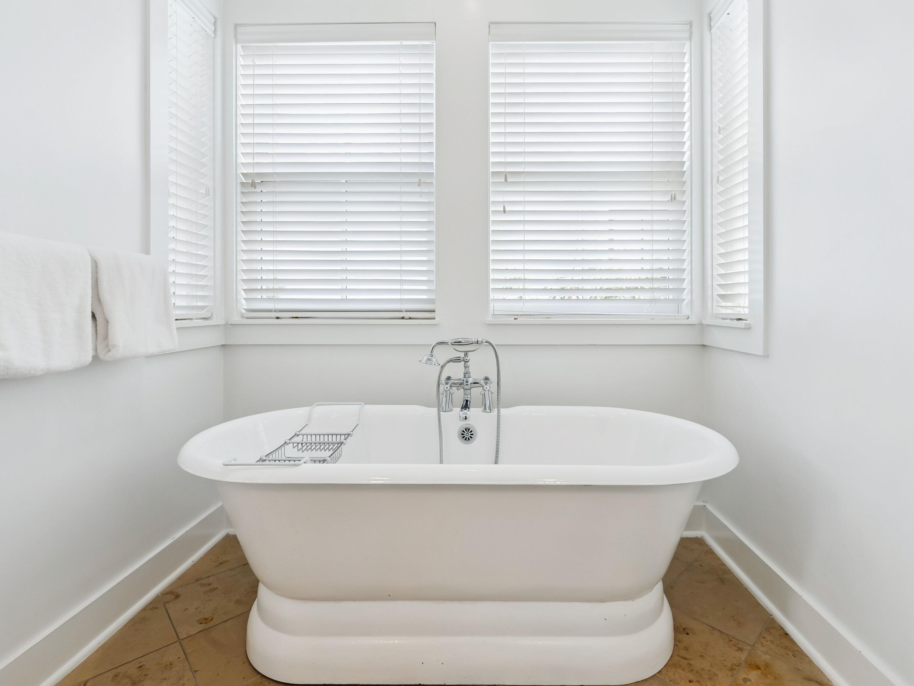 37 Winterberry Circle Santa Rosa Beach, FL 32459 - Photo 7 of 39 a white bath tub sitting in a bathroom next to a window