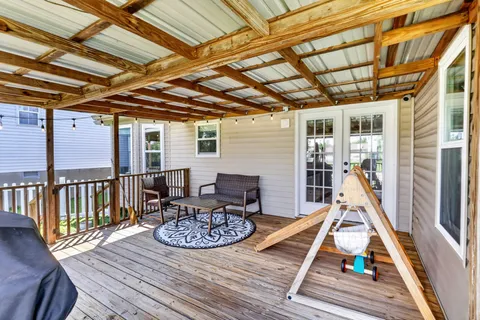 a view of a deck with furniture